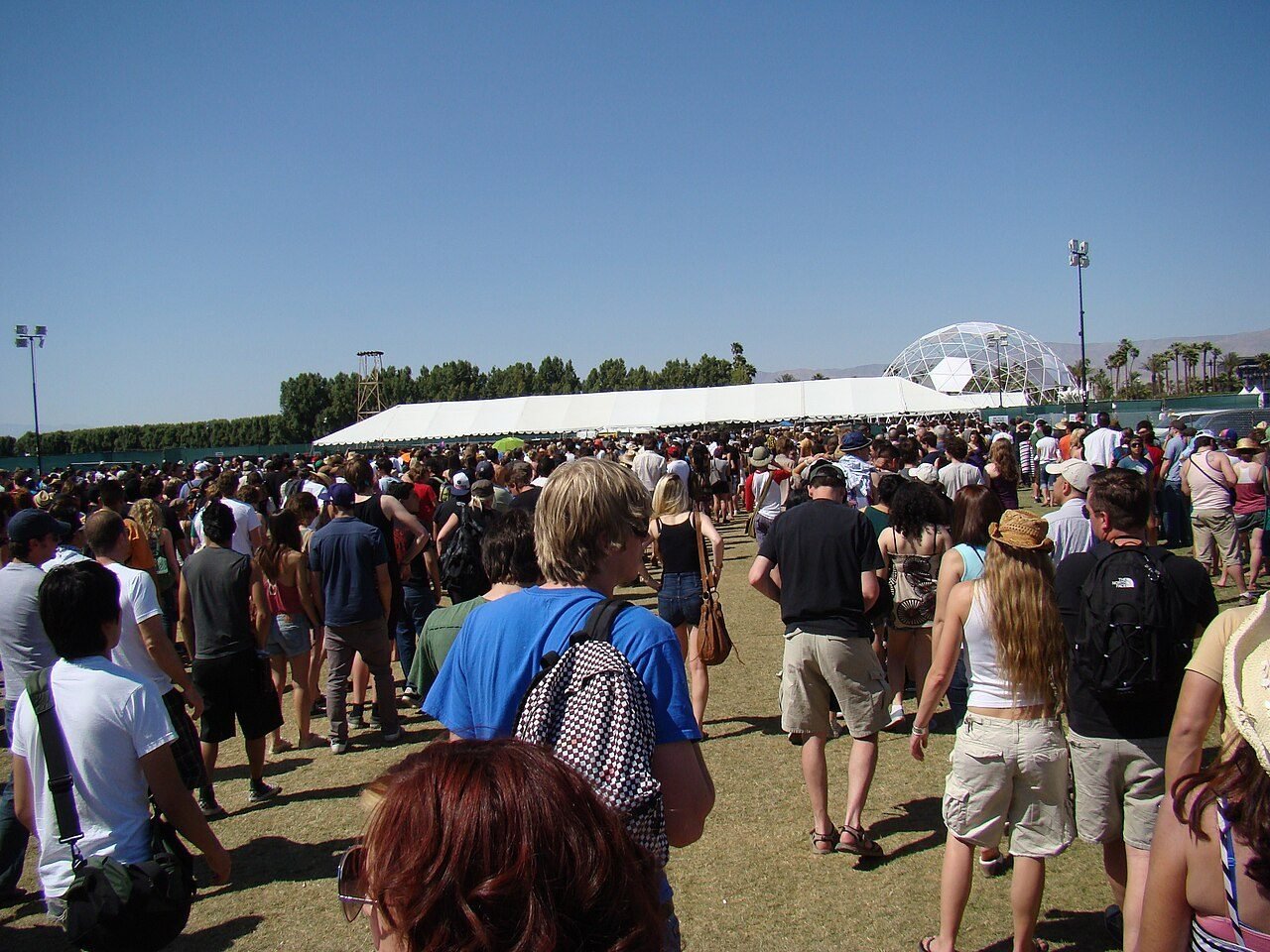 Daytime crowd walking across the grass on day one of Coachella 2009.